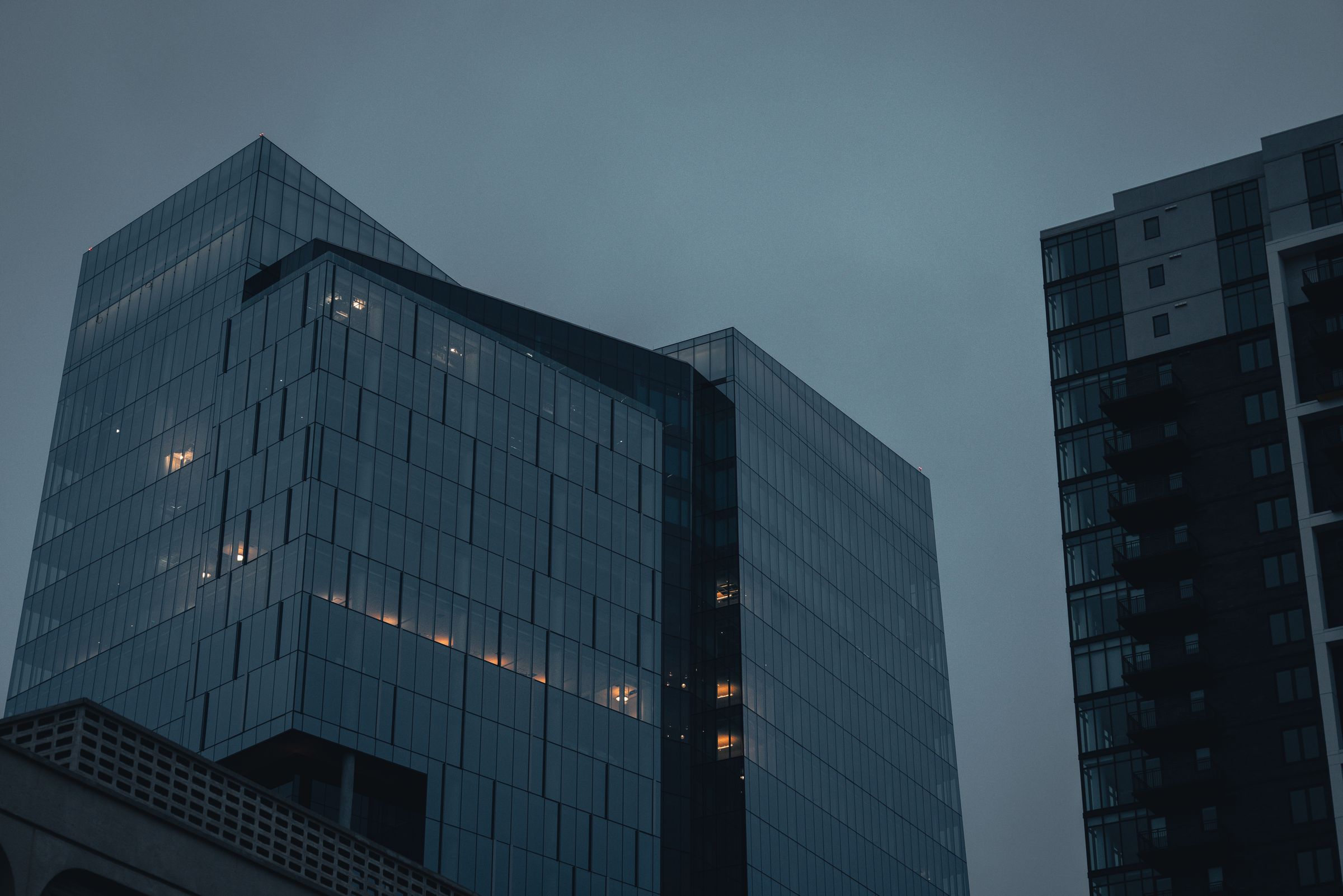 Glass office towers at dusk